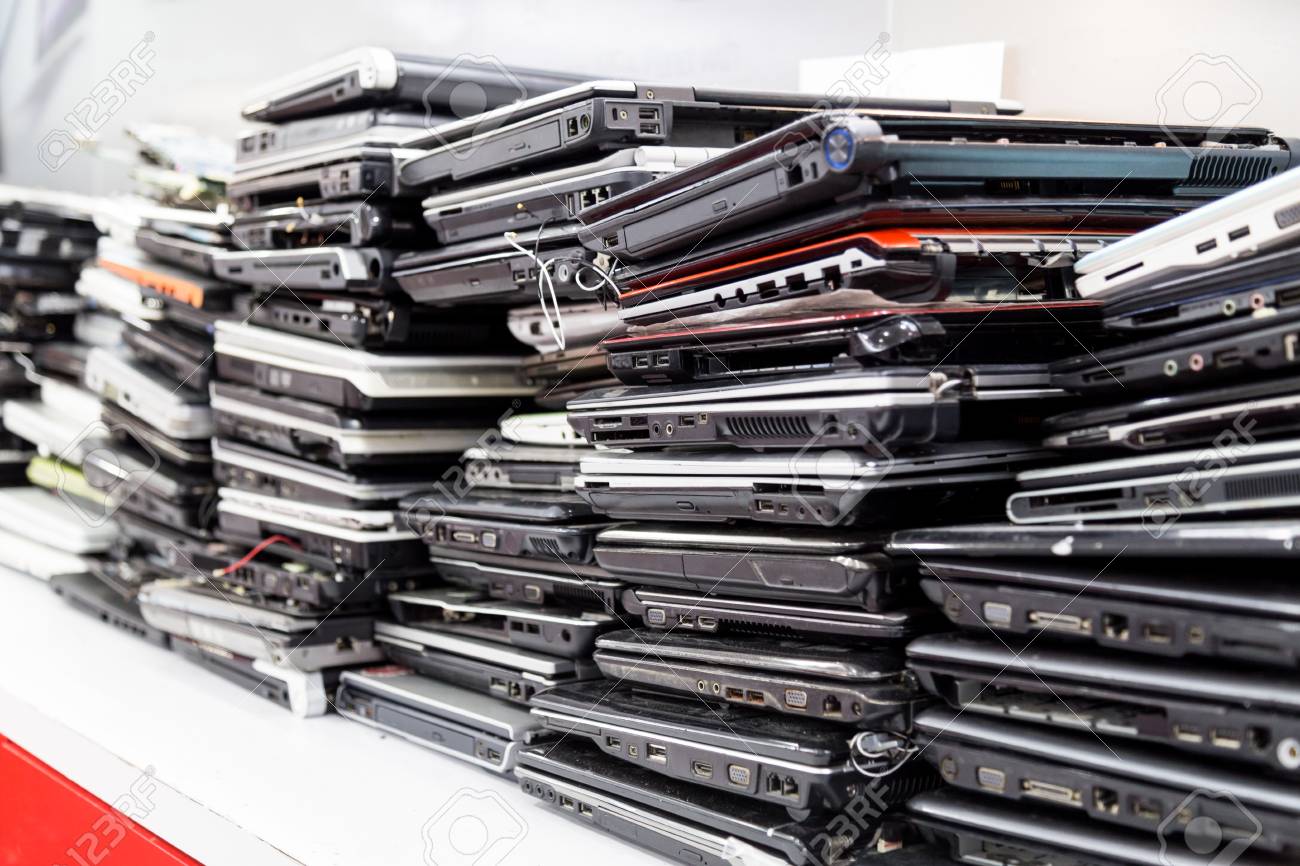 Stack of old, broken and obsolete laptop computer for repair IT Hardware Refurbished